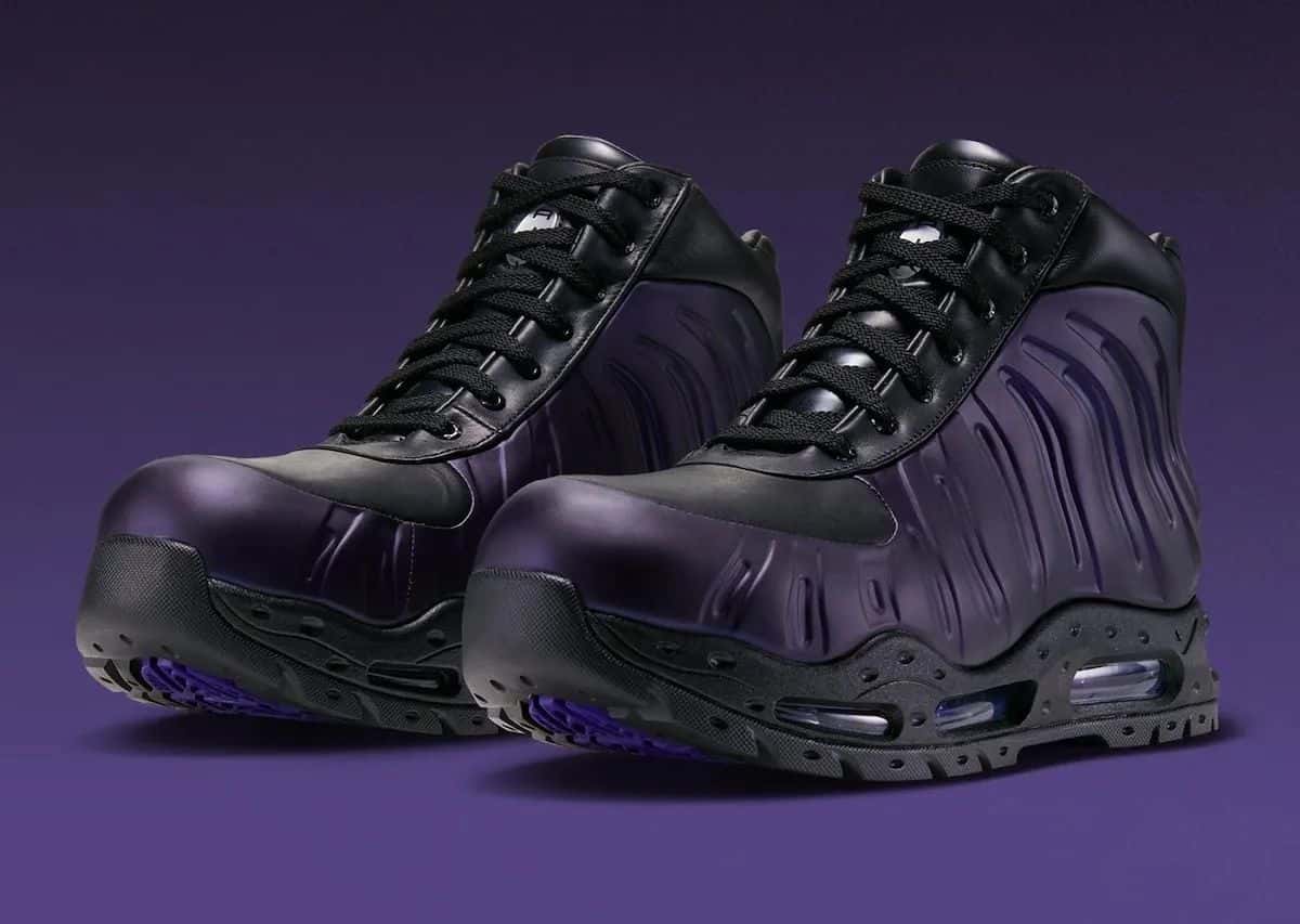 Par de Nike Air Max Foamdome Eggplant con carcasa violeta y cuero negro, sobre fondo violeta