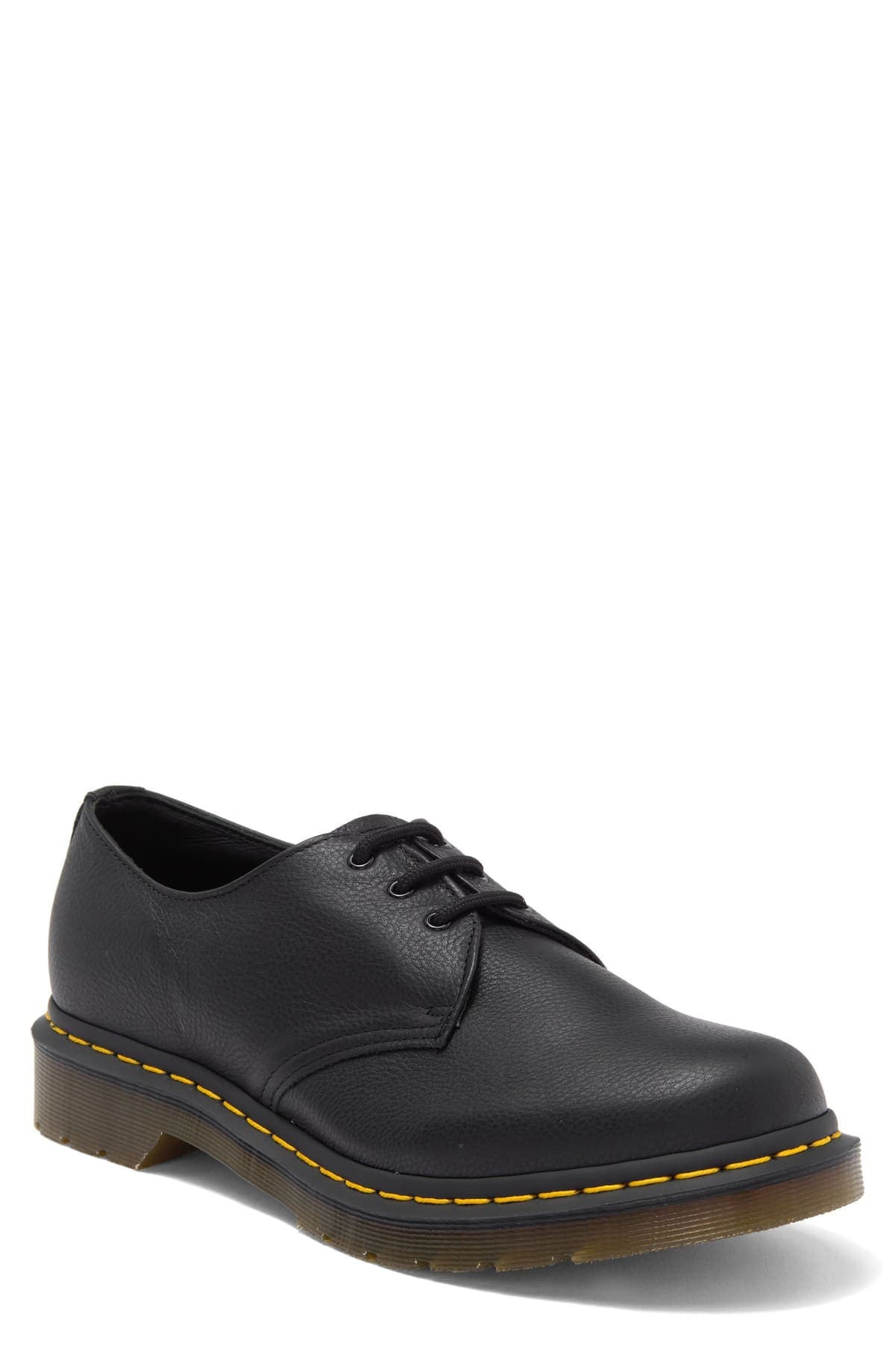 Zapato derby Dr. Martens 1461 de cuero negro granulado, con tres pares de ojales, costura amarilla y suela translúcida